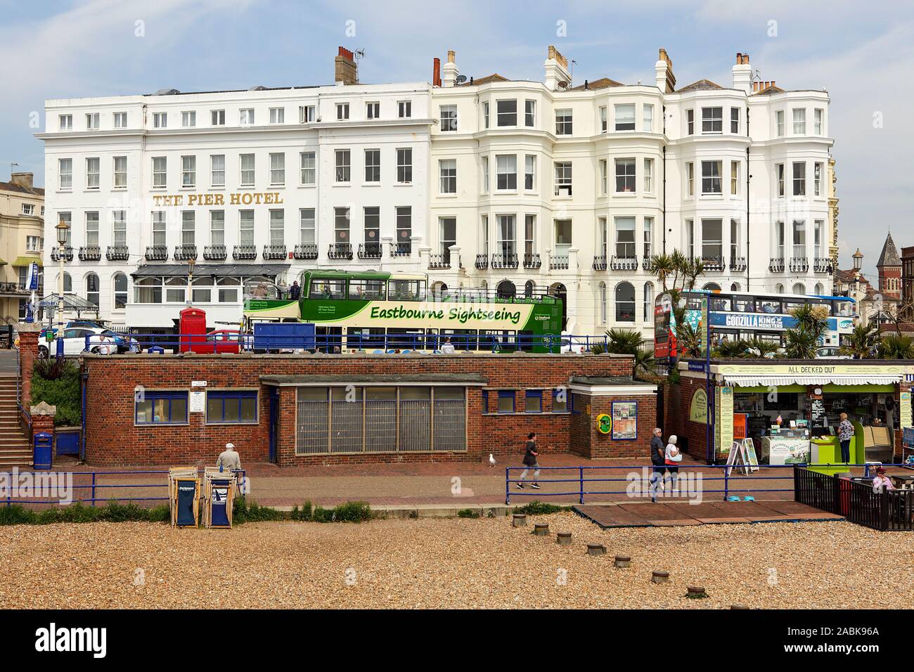 Viewed here in May 2019 is The Pier Hotel in Eastbourne along with accompanying tourist buses and visitors. Stock Photo