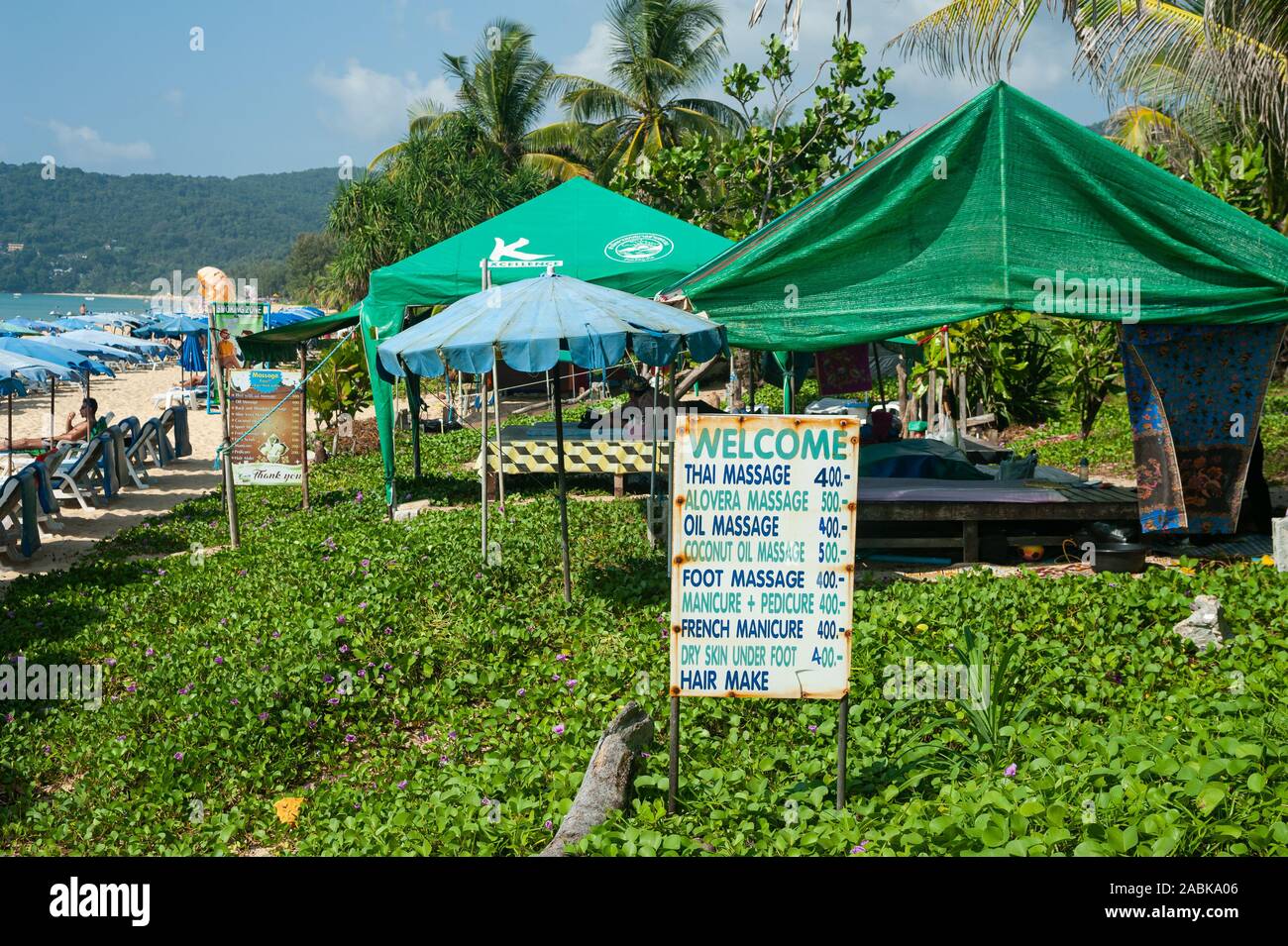 17.11.2019, Phuket, Thailand, Asia - A sign advertises for massages in tents on Karon Beach, a popular holiday destination with Russian tourists. Stock Photo