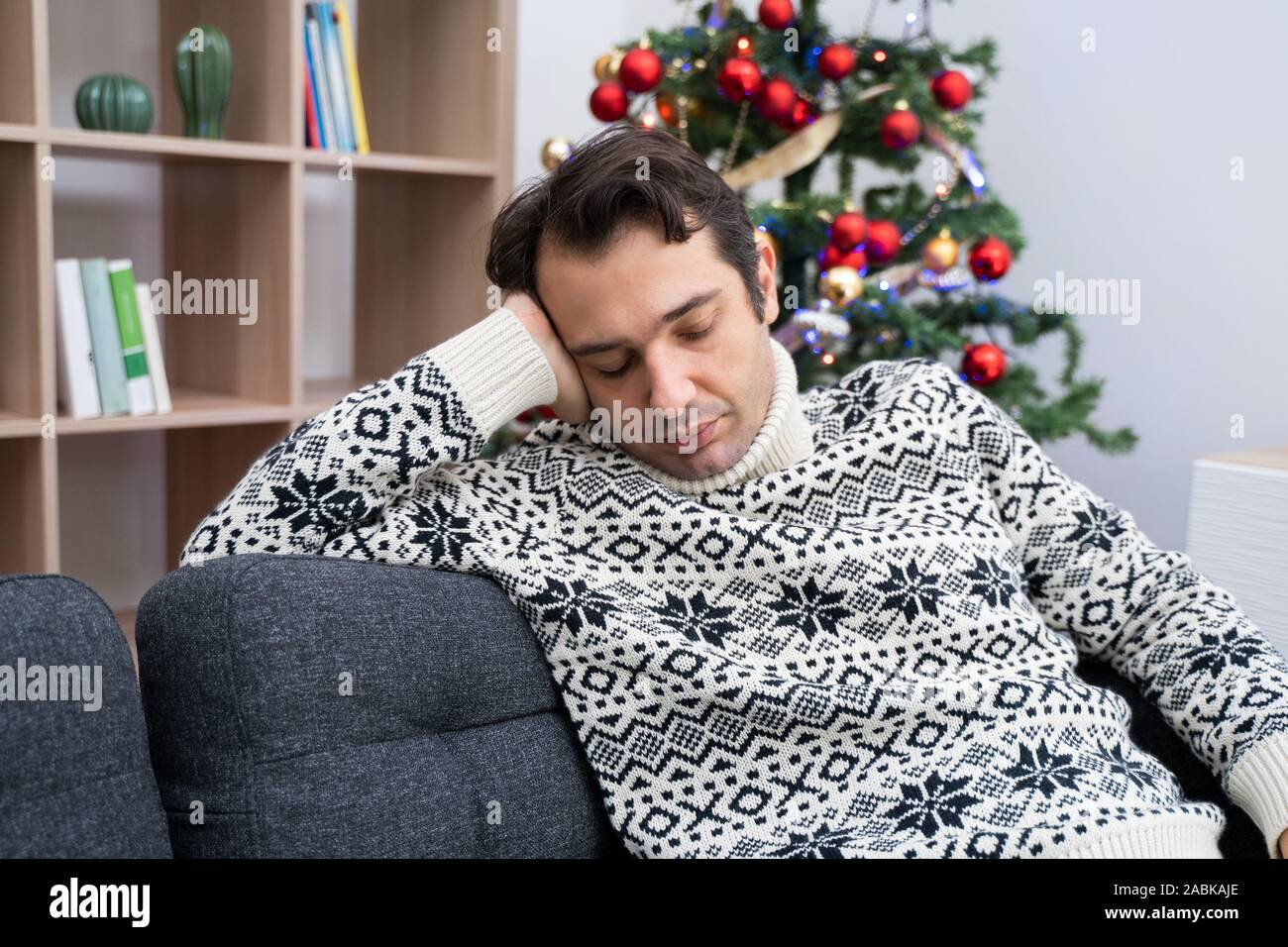 Man portrait feeling cold and freeze at home Stock Photo