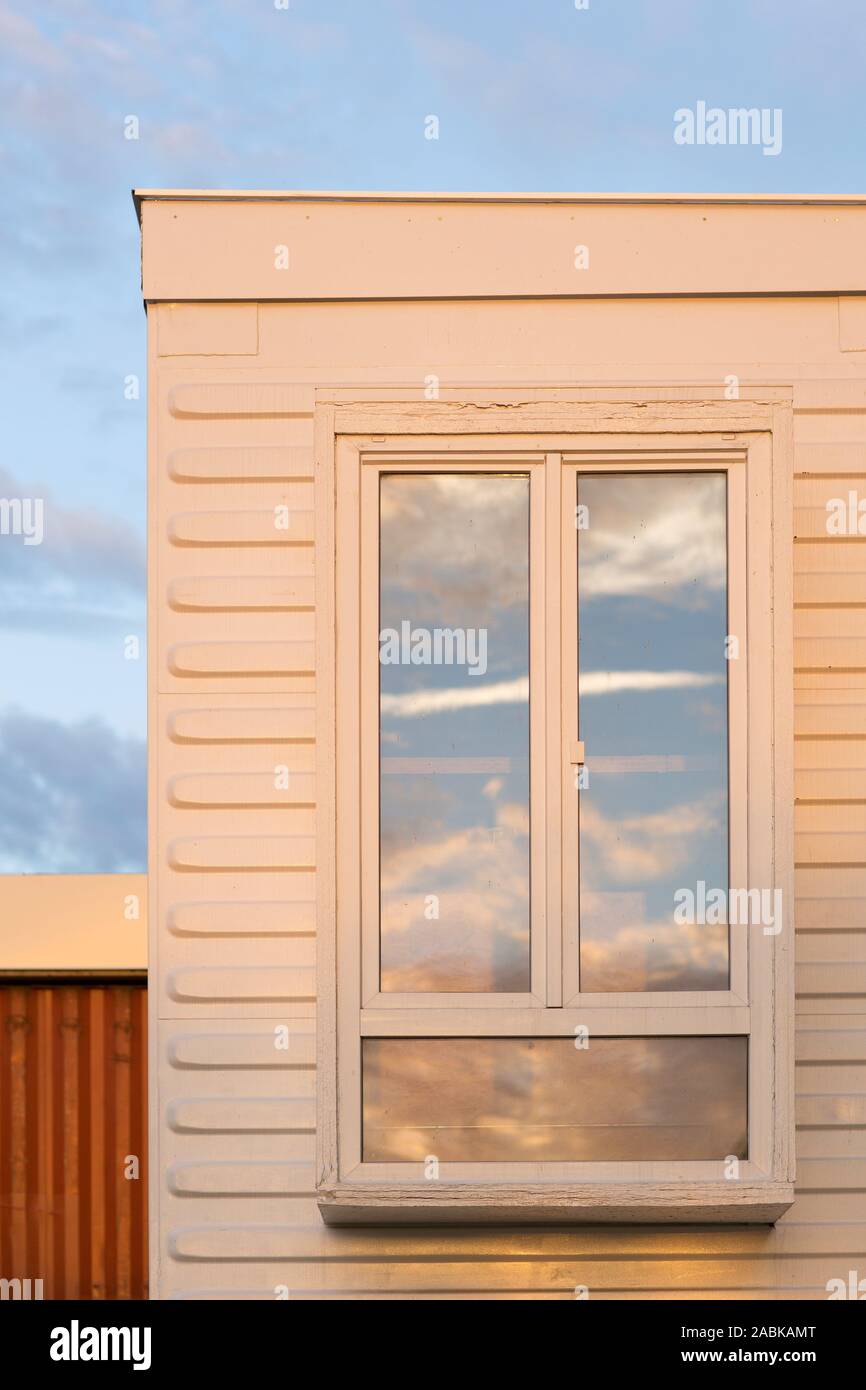 Eindhoven, The Netherlands, July 30th 2018. A detail of a concept for temporary student housing made with a white shipping container. A window and ref Stock Photo