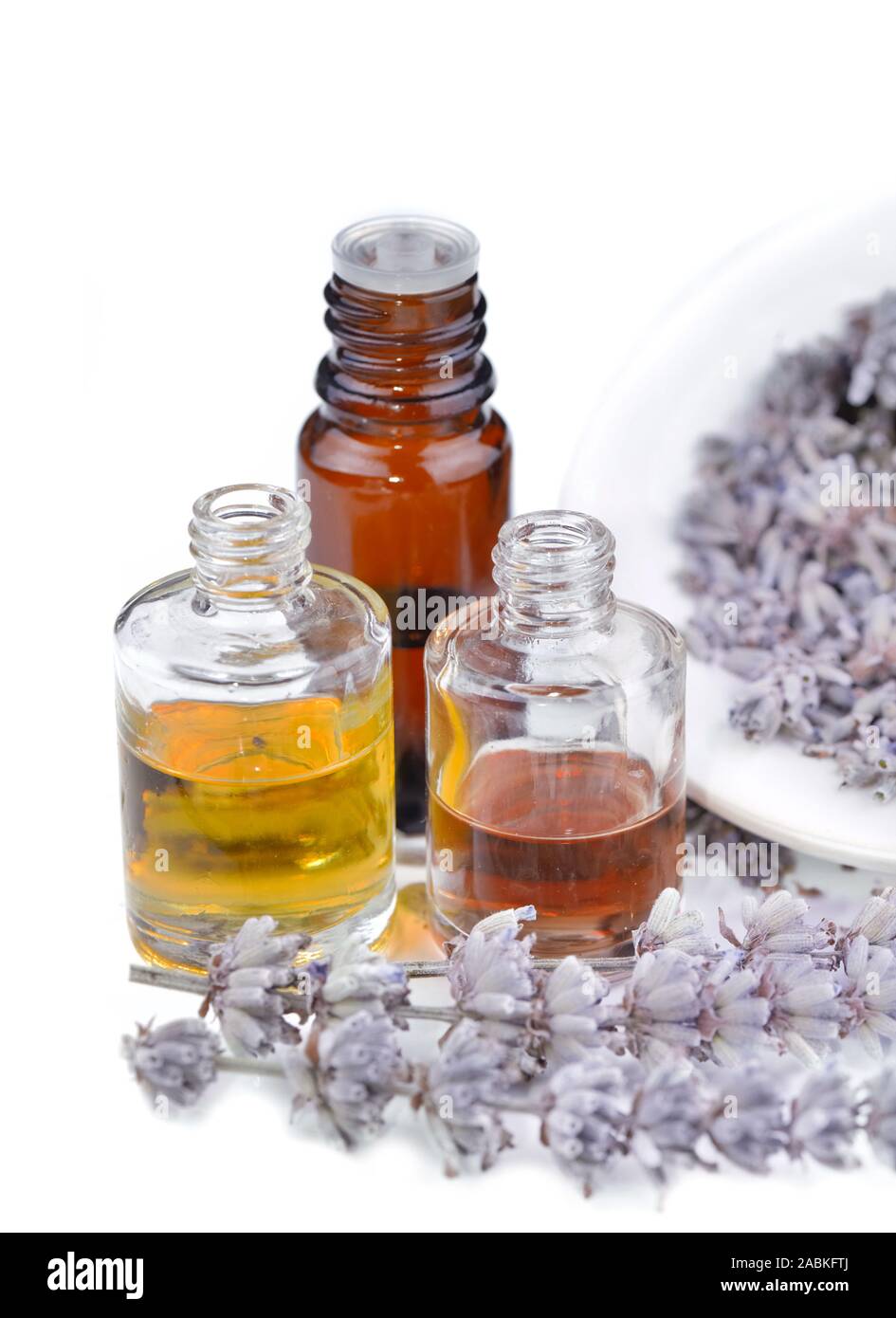 bottles of oil and dried lavender on white background Stock Photo - Alamy
