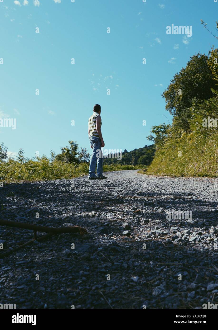 Man walking country road hi-res stock photography and images - Alamy