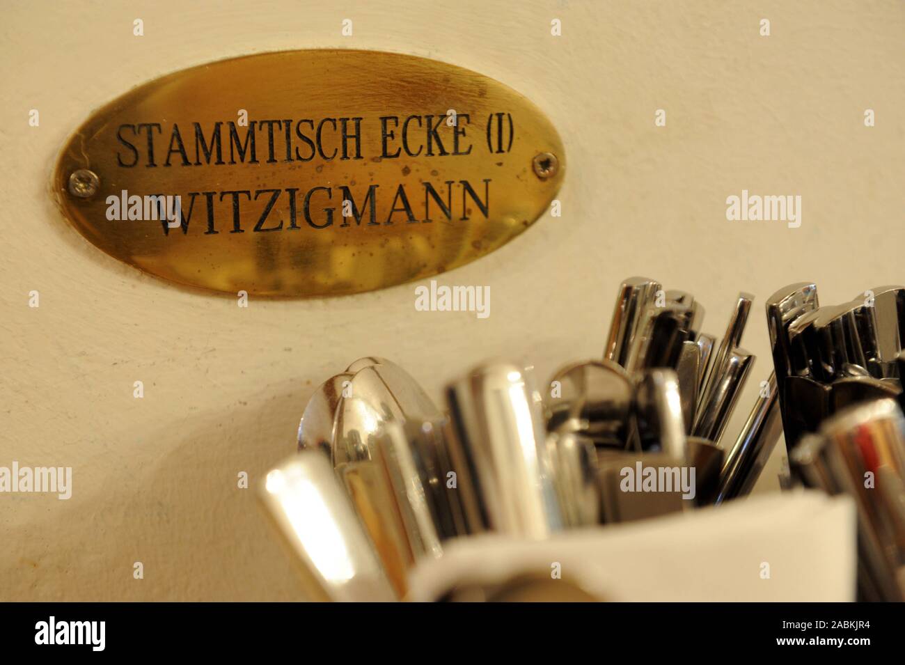 Sign 'Stammtisch Ecke (1) Witzigmann' in the traditional Munich restaurant 'Beim Sedlmayr' in Westenriederstraße 14 at Viktualienmarkt. [automated translation] Stock Photo