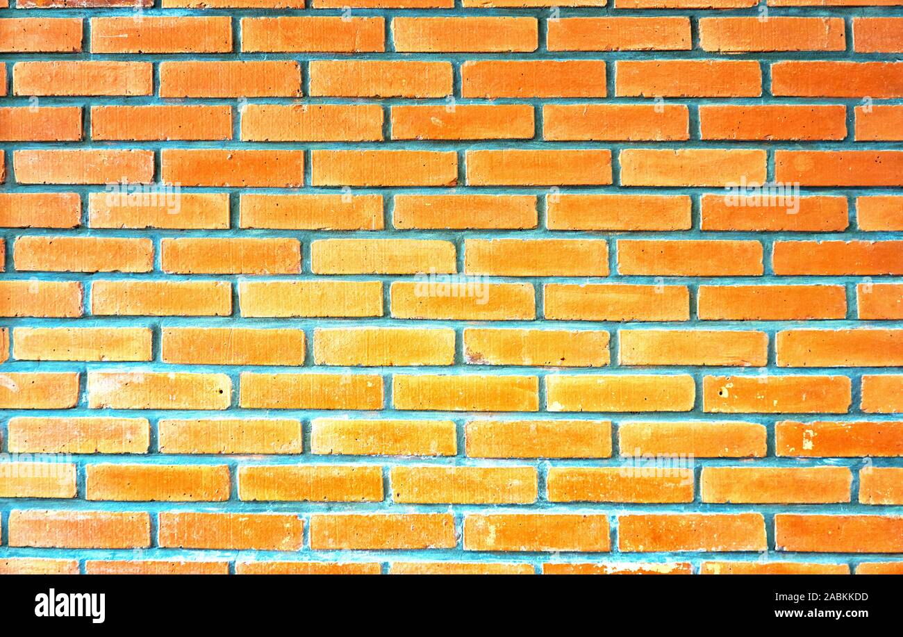 Bright red brick wall background Stock Photo - Alamy