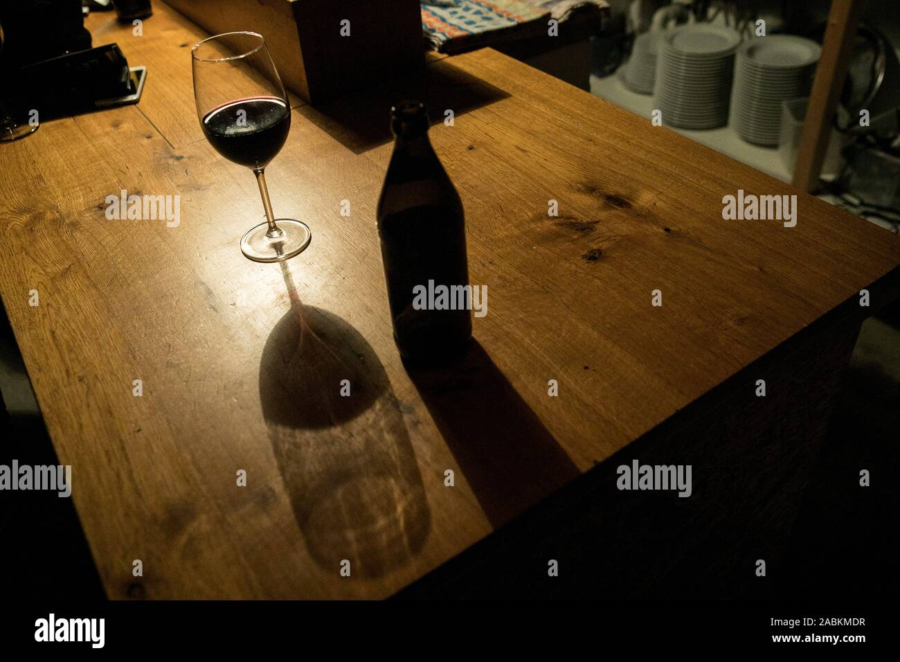Wine glass and beer bottle in the bar "Die Karotte" in the backyard of