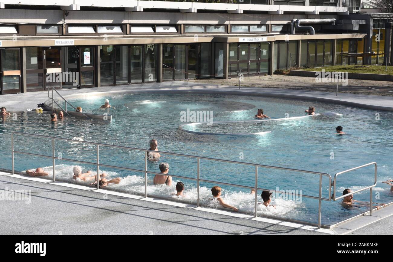 Swimmer on a mild February day in the heated outdoor pool of the