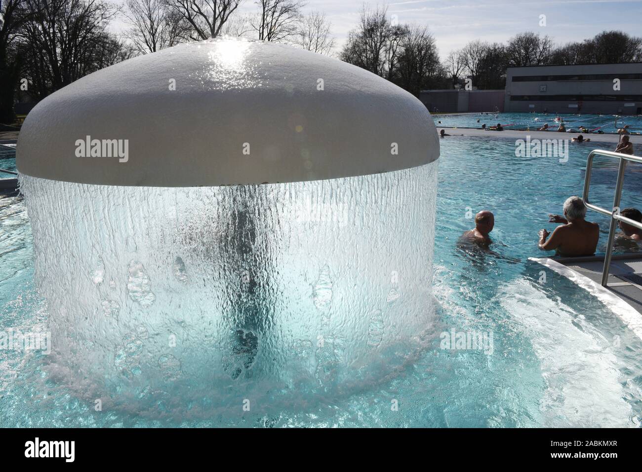 Swimmer on a mild February day in the heated outdoor pool of the