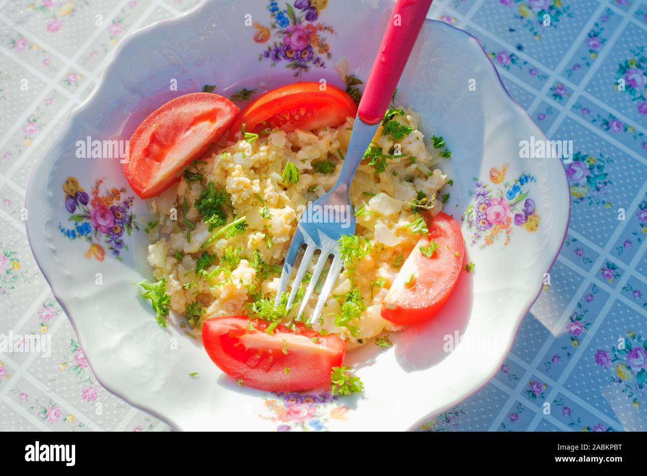 Scrambled eggs with vegetables. Stock Photo