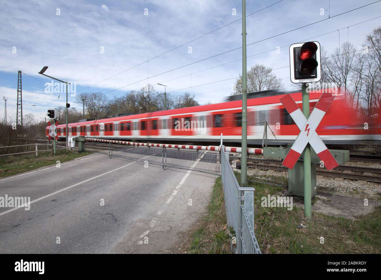 Closed railway barrier at the level crossing on Graf-Lehndorff-Straße in Riem. [automated translation] Stock Photo