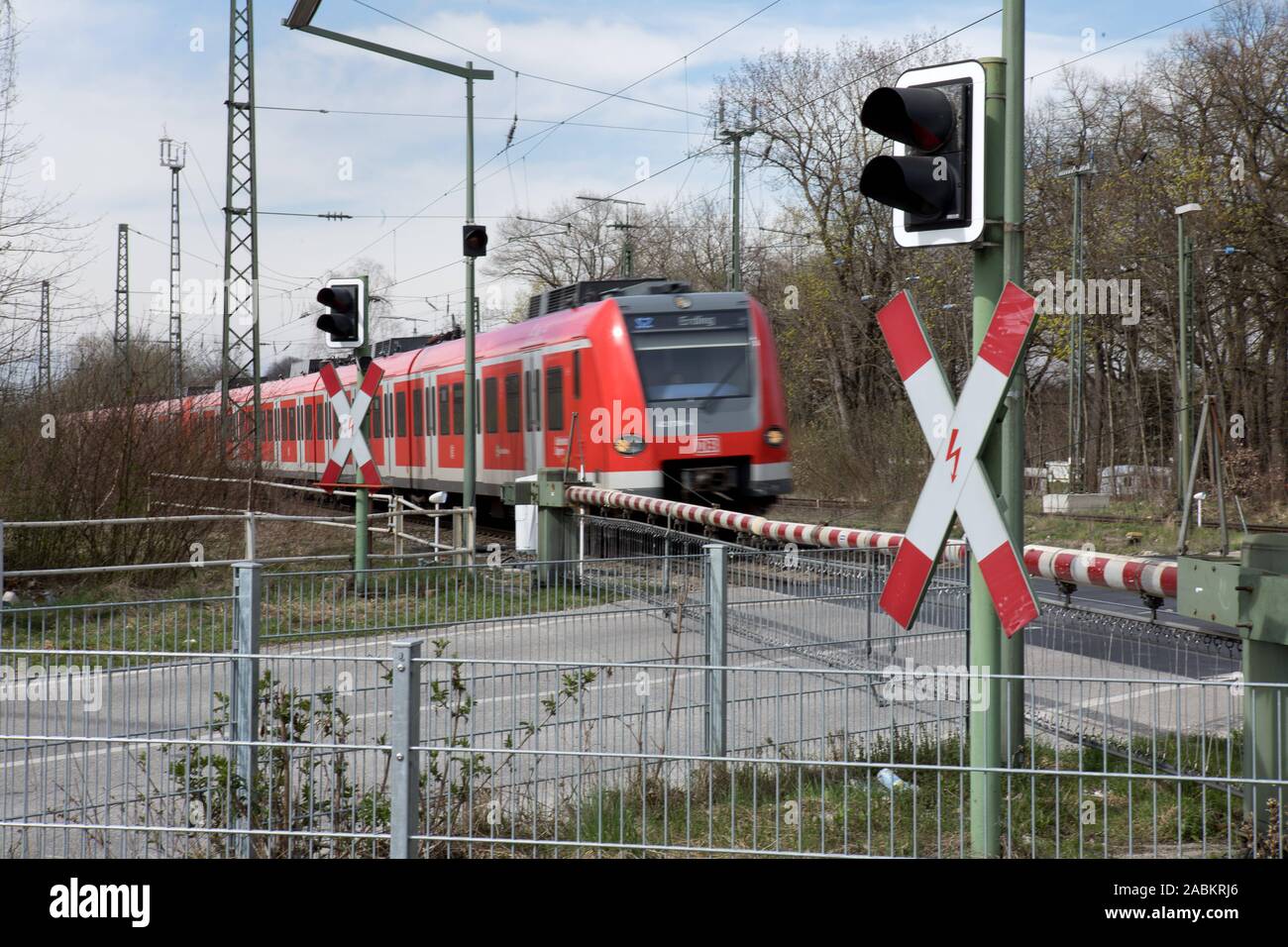 Closed railway barrier at the level crossing on Graf-Lehndorff-Straße in Riem. [automated translation] Stock Photo