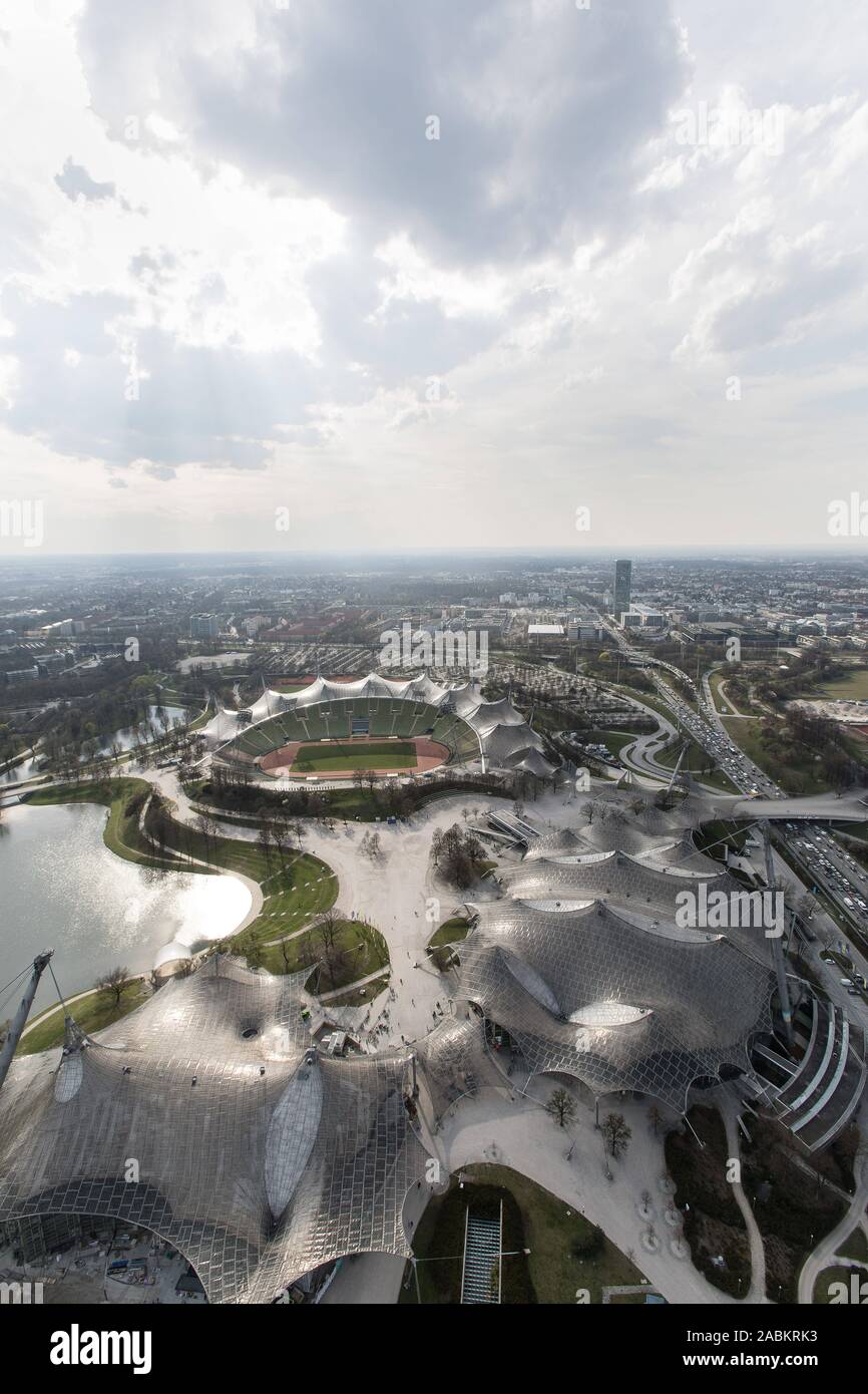 Panoramic view from the Munich Olympic Tower onto the Olympic Park with the Olympic Swimming Hall (l), the Olympic Hall (r.), the Olympic Lake and the Olympic Stadium. On the right in the background the O2 skyscraper. [automated translation] Stock Photo