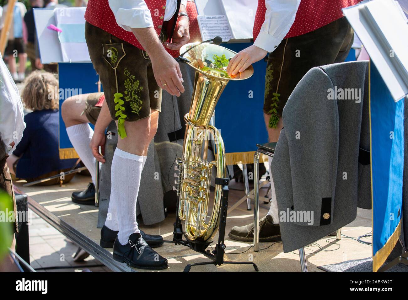 The Olchinger Maypole is traditionally erected by hand. Musicians frame ...