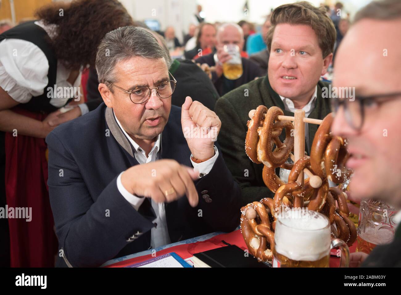 The former party chairman Sigmar Gabriel (l.) sits at the party evening of the SPD in the beer tent on the Truderinger spring festival with Florian post office (m.) and Markus Rinderspacher at a table. [automated translation] Stock Photo