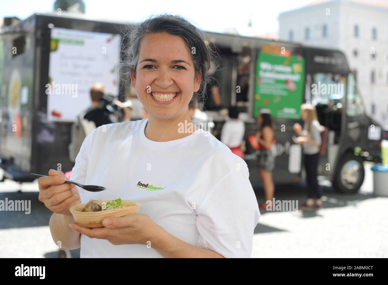 Günes Seyfahrt, founder of the association 'Foodsaver München', stands in front of a food truck at Geschwister-Scholl-Platz with an ice cream made of rescued fruit. The joint action of the Bavarian Ministry of Nutrition and 'Foodsharing Munich' would like to draw attention to the waste of food by offering free food that has been saved from destruction. [automated translation] Stock Photo