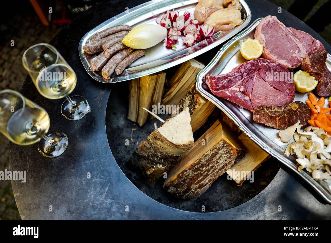 Recently the staff of the wine bar 'Lump, Stein und Küchenmeister' started grilling with the new Ofyr-Grill. In the picture prepared trays with meat and vegetables. [automated translation] Stock Photo