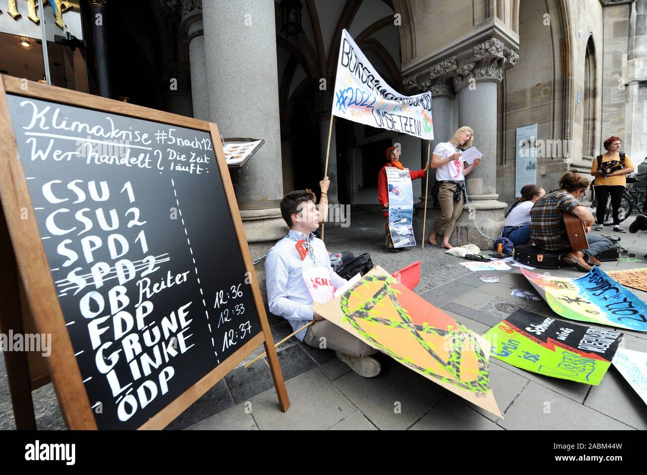 Climate protection activists of the 'Extinction Rebellion' group are protesting against the city's plan to allow the hard coal-fired unit of the Munich-North combined heat and power plant to continue to run after 2022 with a chain protest in front of the Munich City Hall. This would mean that those responsible would ignore the successful citizens' decision to withdraw from the coal industry prematurely. [automated translation] Stock Photo