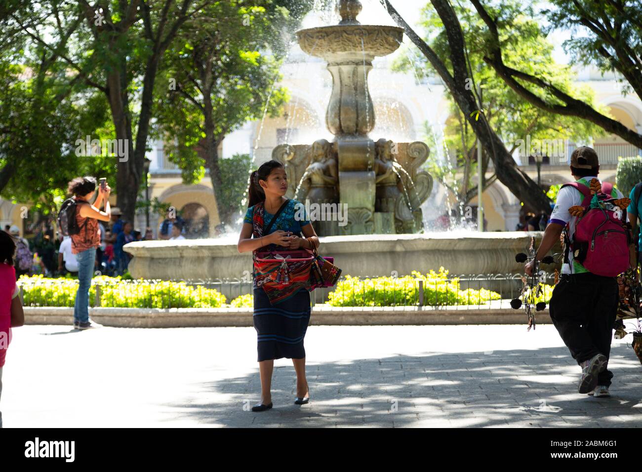 Guatemalan girl with typical costume selling Stock Photo