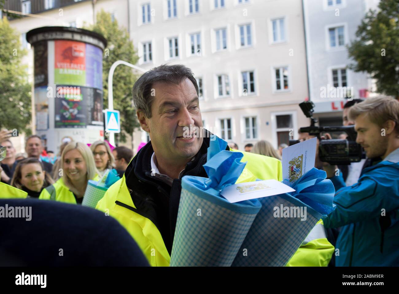 Prime Minister Markus Söder (pictured with double school bag) works as a student pilot on the first day of school in front of the St.-Anna primary school in Lehel. [automated translation] Stock Photo