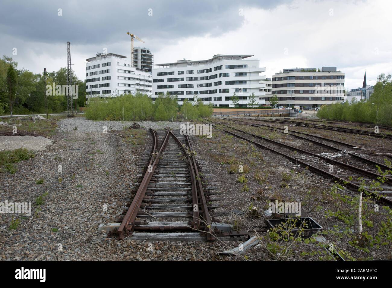 View of the new residential buildings in the Baumkirchen Mitte Landscape Park in Munich from disused tracks. [automated translation] Stock Photo