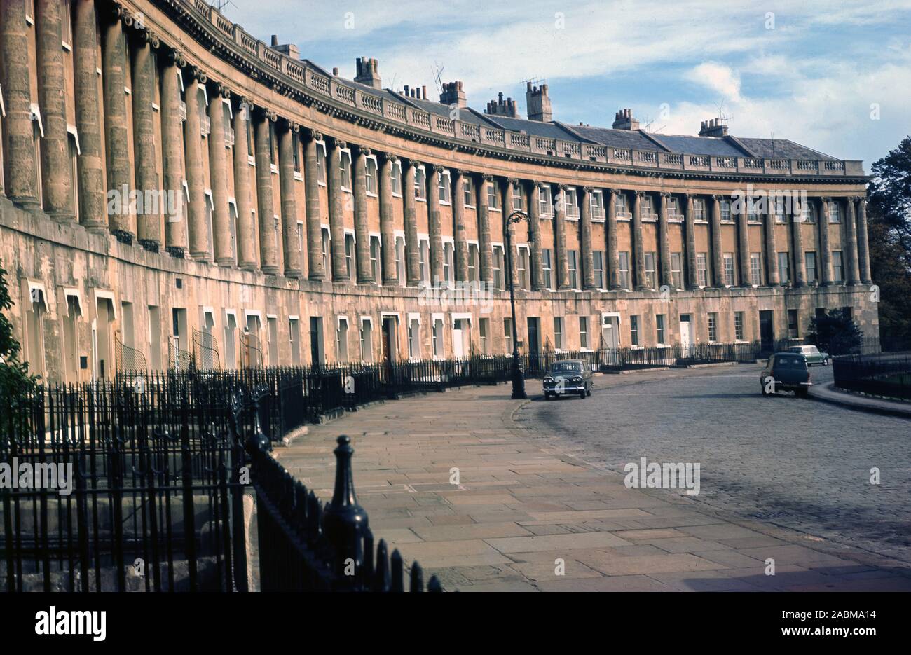 1960s, historical,  a view from this era of Royal Cresent, Bath, England, UK. Completed in 1774, this row of 30 terraced houses laid out in a sweeping crescent in the city by architect John Wood, the younger, is considered one of the greatest examples of Georgian architecture in Britain. Stock Photo