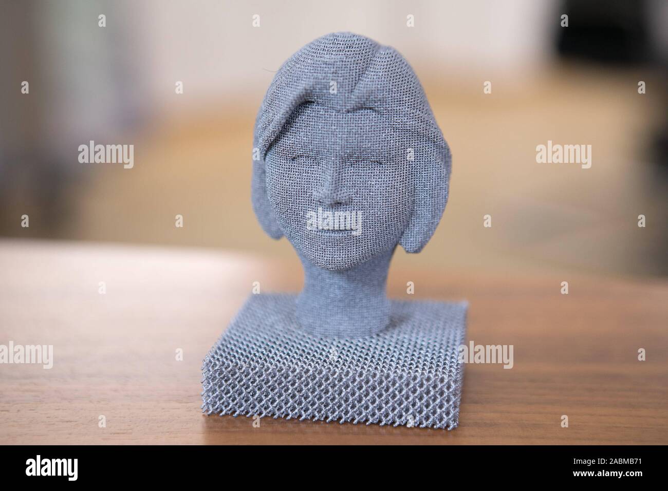 On the desk in the provisional office of Ilse Aigner (CSU), President of the State Parliament, in an old building in downtown Munich, there is a 3-D print of her head, taken from a photo. [automated translation] Stock Photo