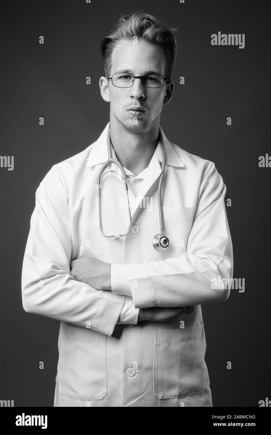 Young confident doctor in white Black and White Stock Photos & Images ...