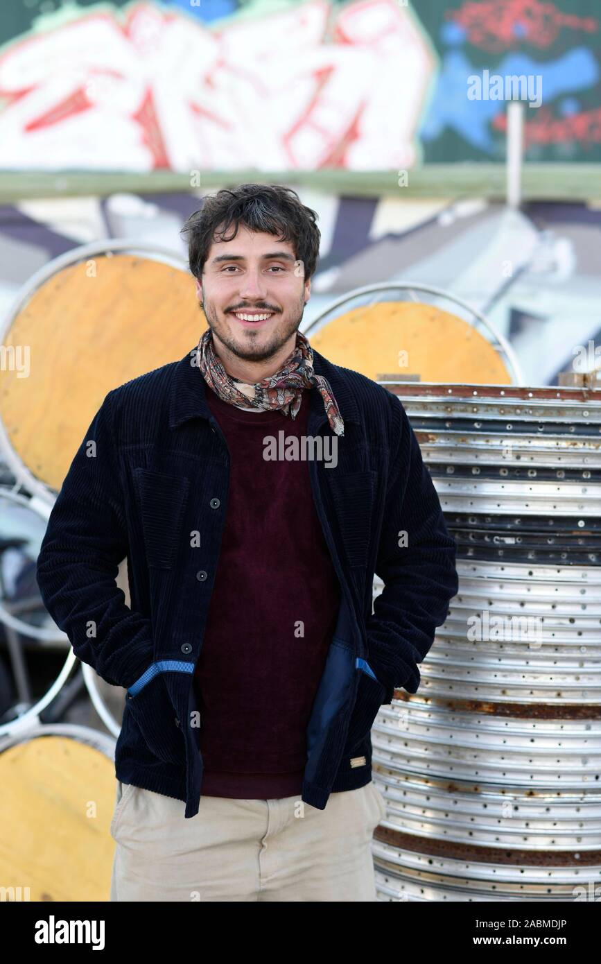 Daniel Hahn, managing director of 'Bahnwärter Thiel', in front of an old subway car on the former cattle yard site, which he uses as an office. [automated translation] Stock Photo