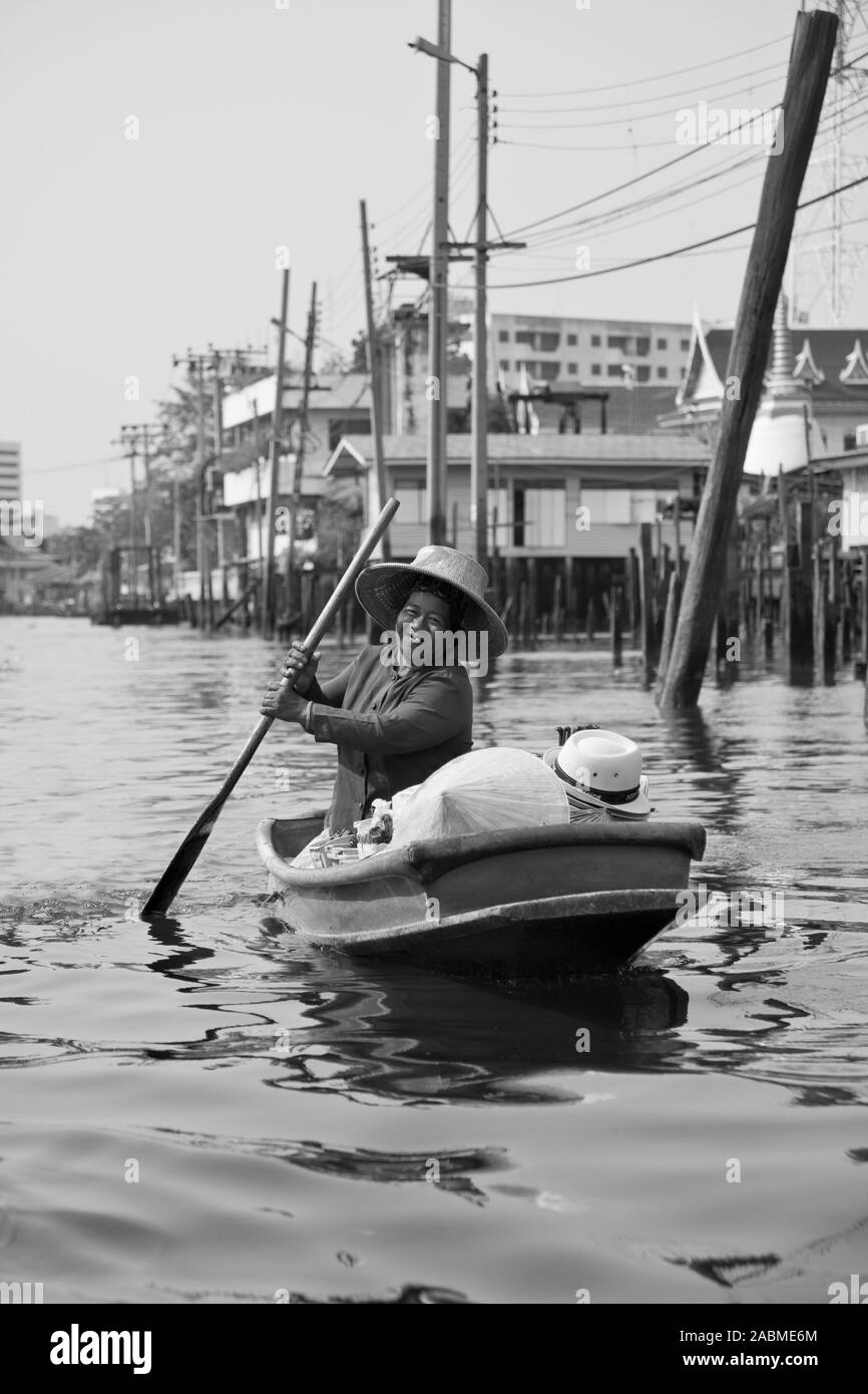 Lady rowing a boat Black and White Stock Photos & Images - Alamy