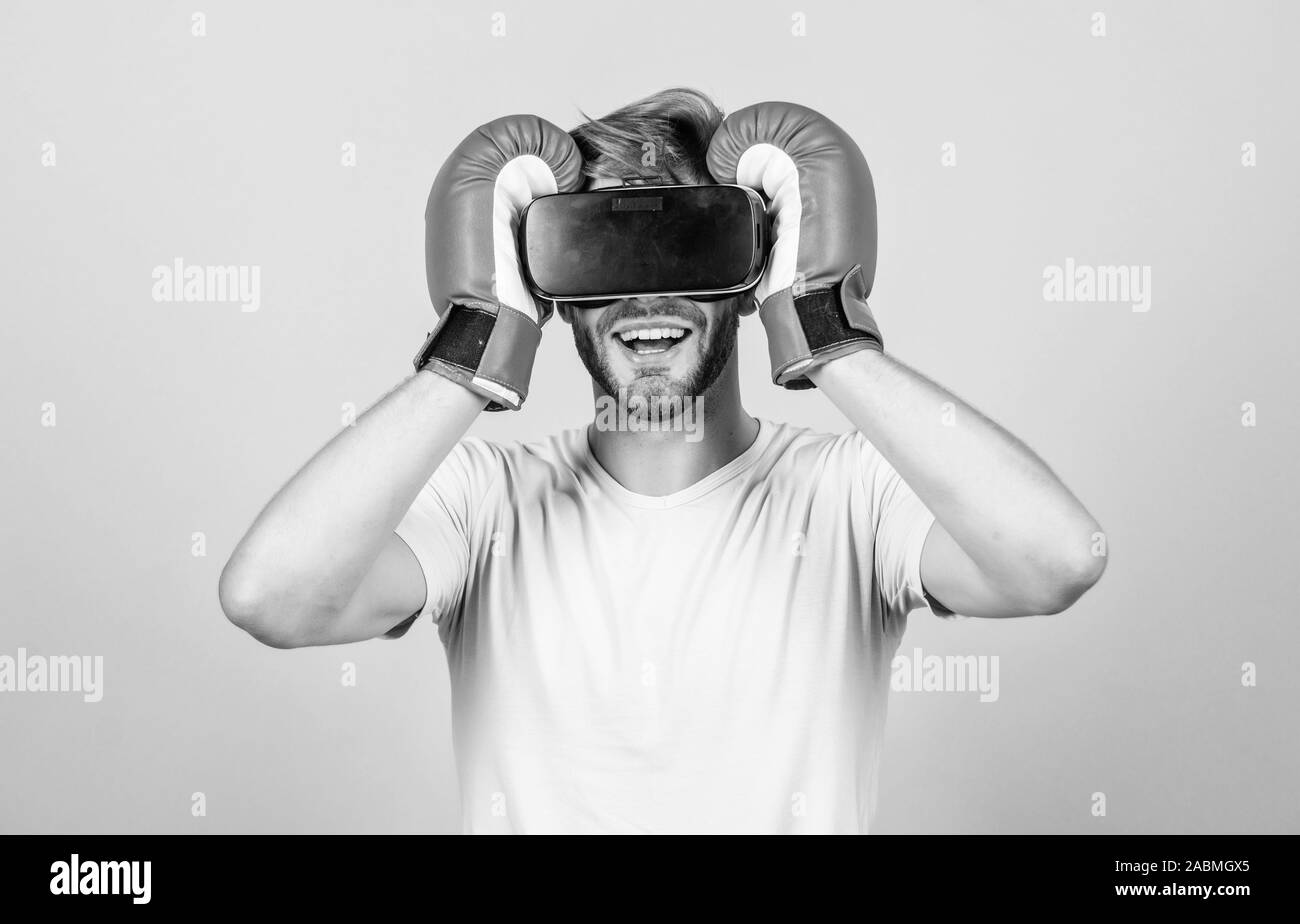 Modern technologies. man use new technology. boxing in virtual reality. Digital sport success. vr boxing. future innovation. modern gadget. Training boxing game. man in VR glasses. Futuristic gaming. Stock Photo