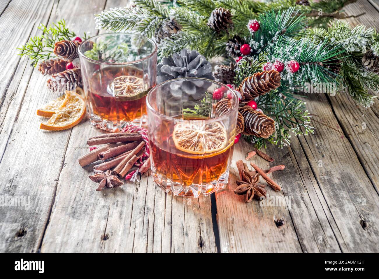 Christmas Winter Alcohol Drink Orange Spice And Bourbon Whiskey Alcoholic Cocktail In Two Glasses Wooden Background With Christmas Tree Branches An Stock Photo Alamy