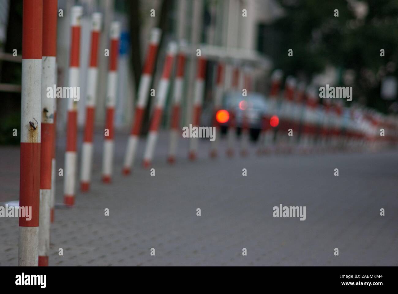 Red and white street bollards Stock Photo