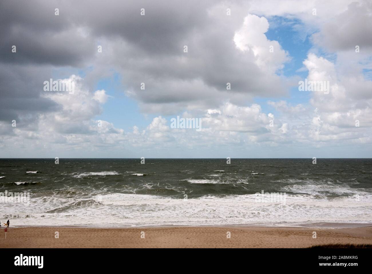 Regenwolken ueber Strand und Meer Stock Photo
