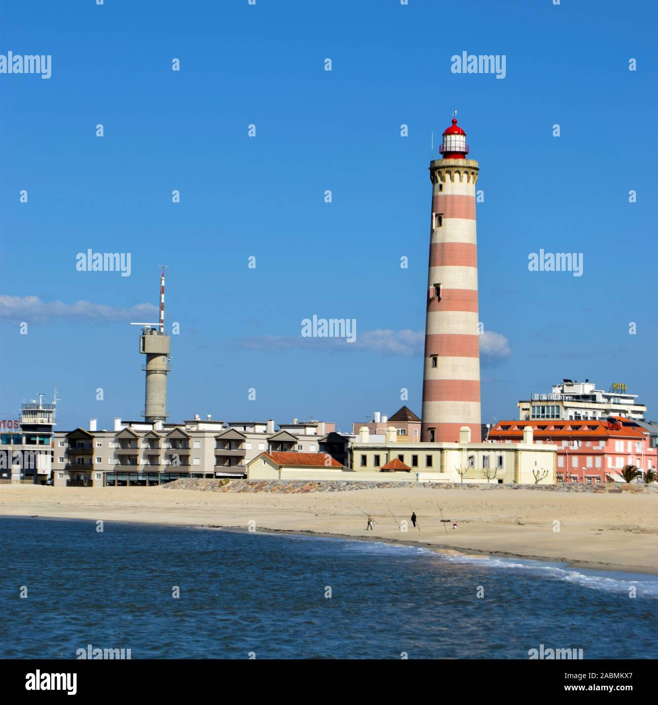 The beach and  lighthouse - the 2nd tallest in Europe - at the Praia da Barra near Aveiro Portugal Stock Photo