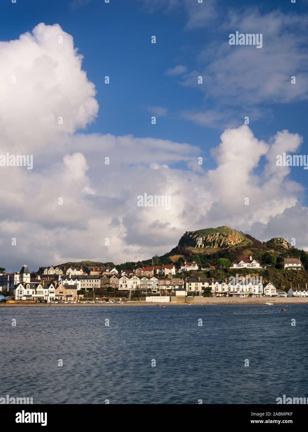 View NE from Conwy marina across the estuary to Deganwy town & the twin peaks of Deganwy Castle (Castell Degannwy), North Wales, UK. Stock Photo