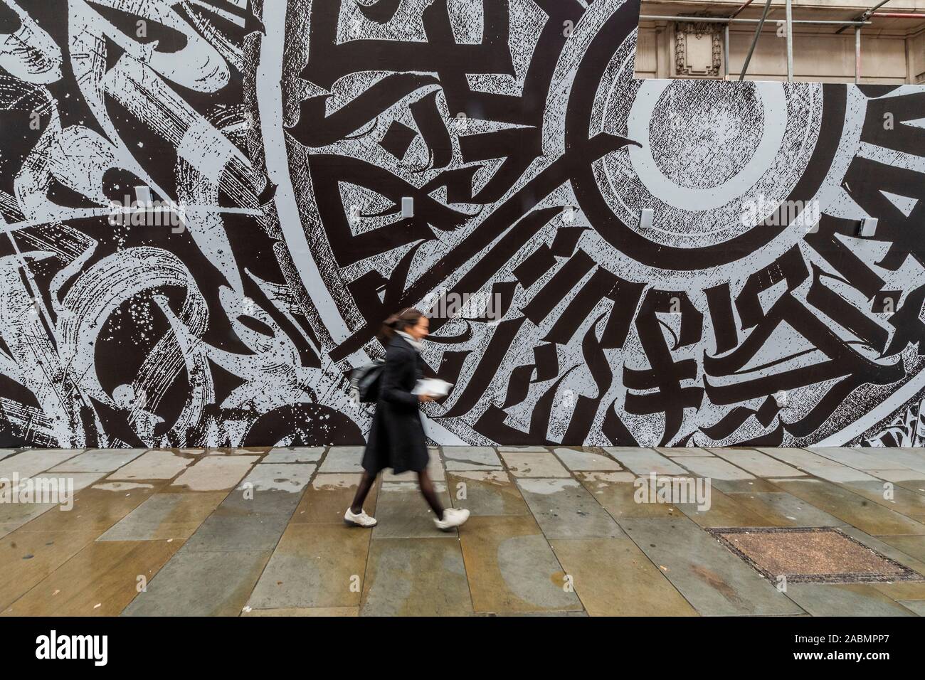 London, UK. 28th Nov 2019. EMBARGOED Online until 0001 29/11/19 OK for Print Tomorrow - Japanese fashion label Comme des Garcons in collaboration with Opera Gallery London unveils a large graffiti mural on the front of Dover Street Market’s building. It was created by the Russian calligraphy and graffiti artist Pokras Lampas, as part of Dover Street Market’s 15th anniversary celebrations. Credit: Guy Bell/Alamy Live News Stock Photo