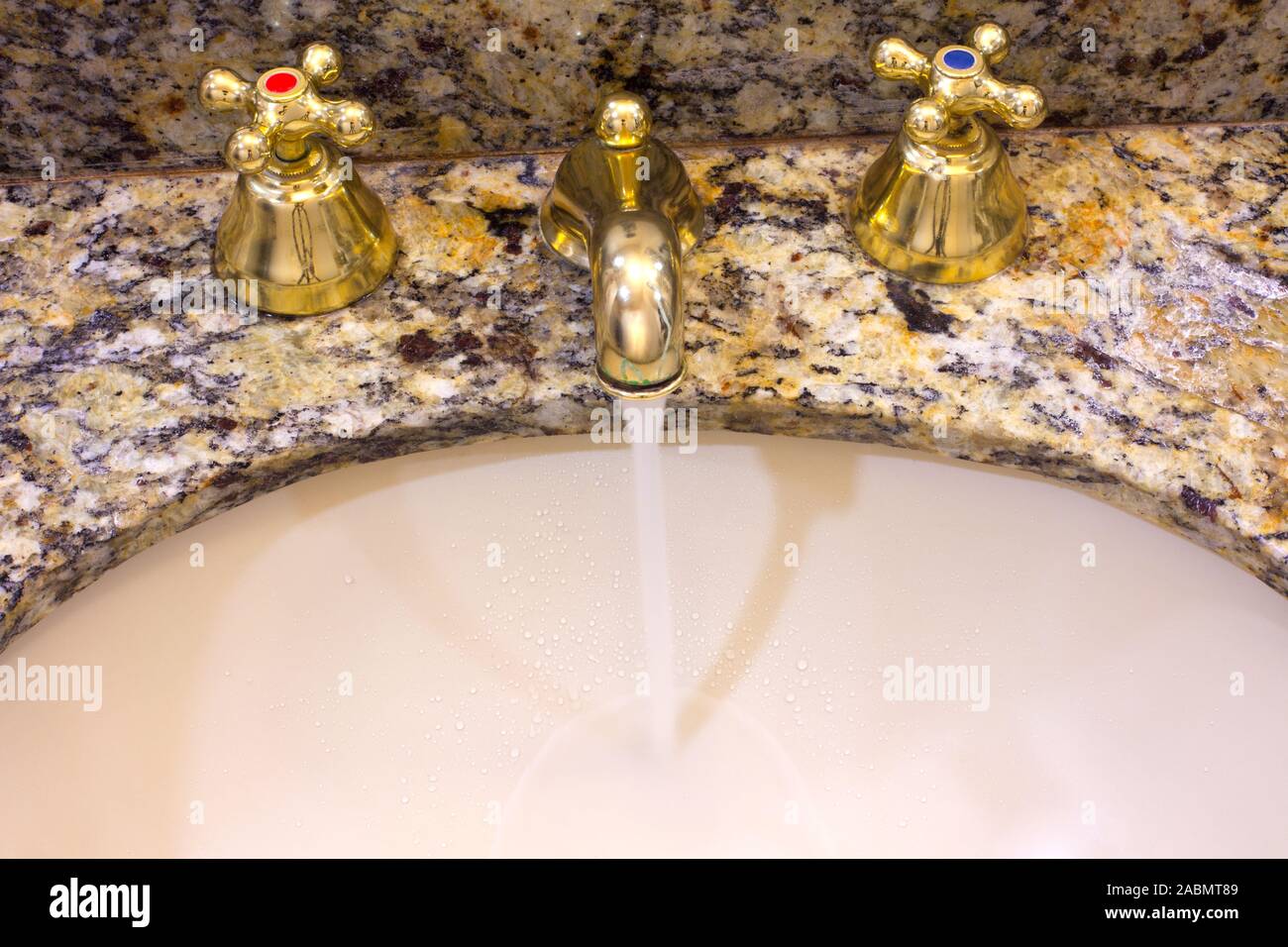 Faucet in an Hotel Bathroom with Running Water Stock Photo Alamy