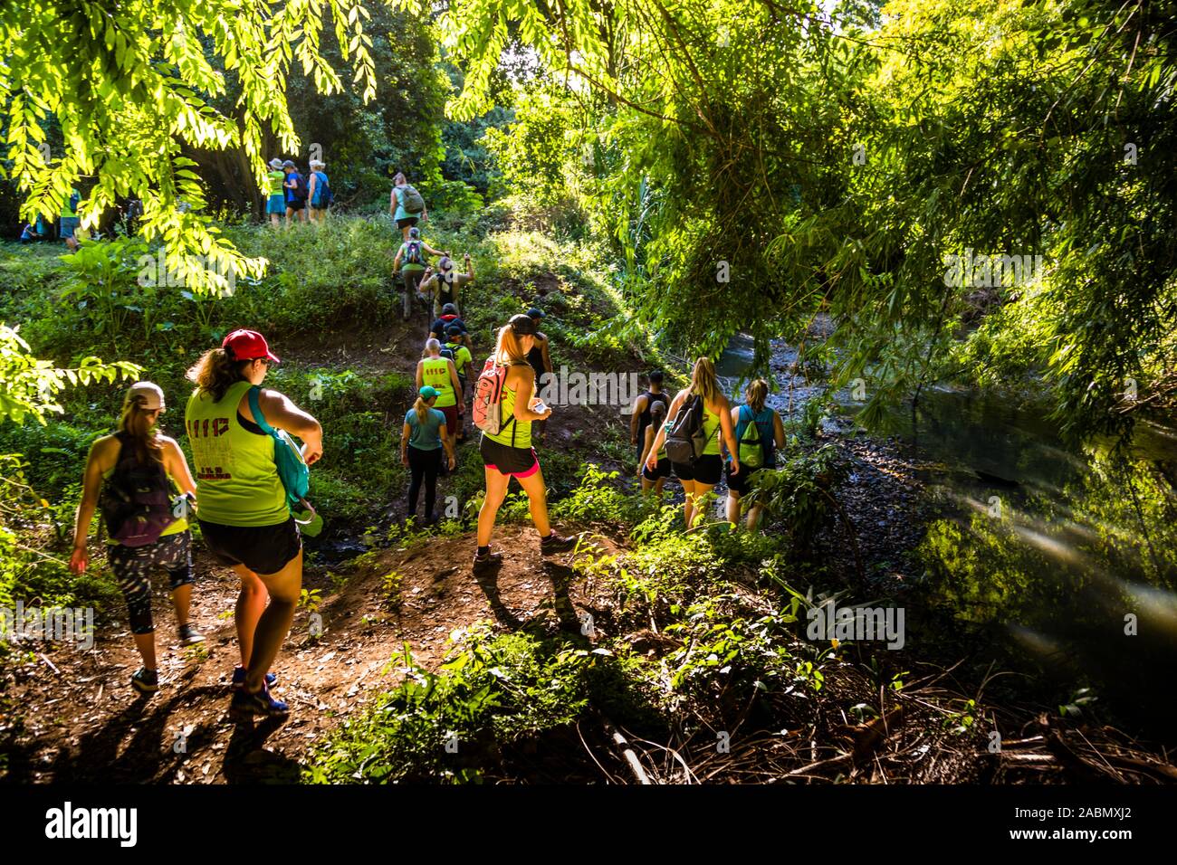 Hash House Harriers Running Event in Happy Hill, Grenada. Over hill and dale, through streams and up muddy slopes. Shortly after the start the runners have separated from the hikers Stock Photo