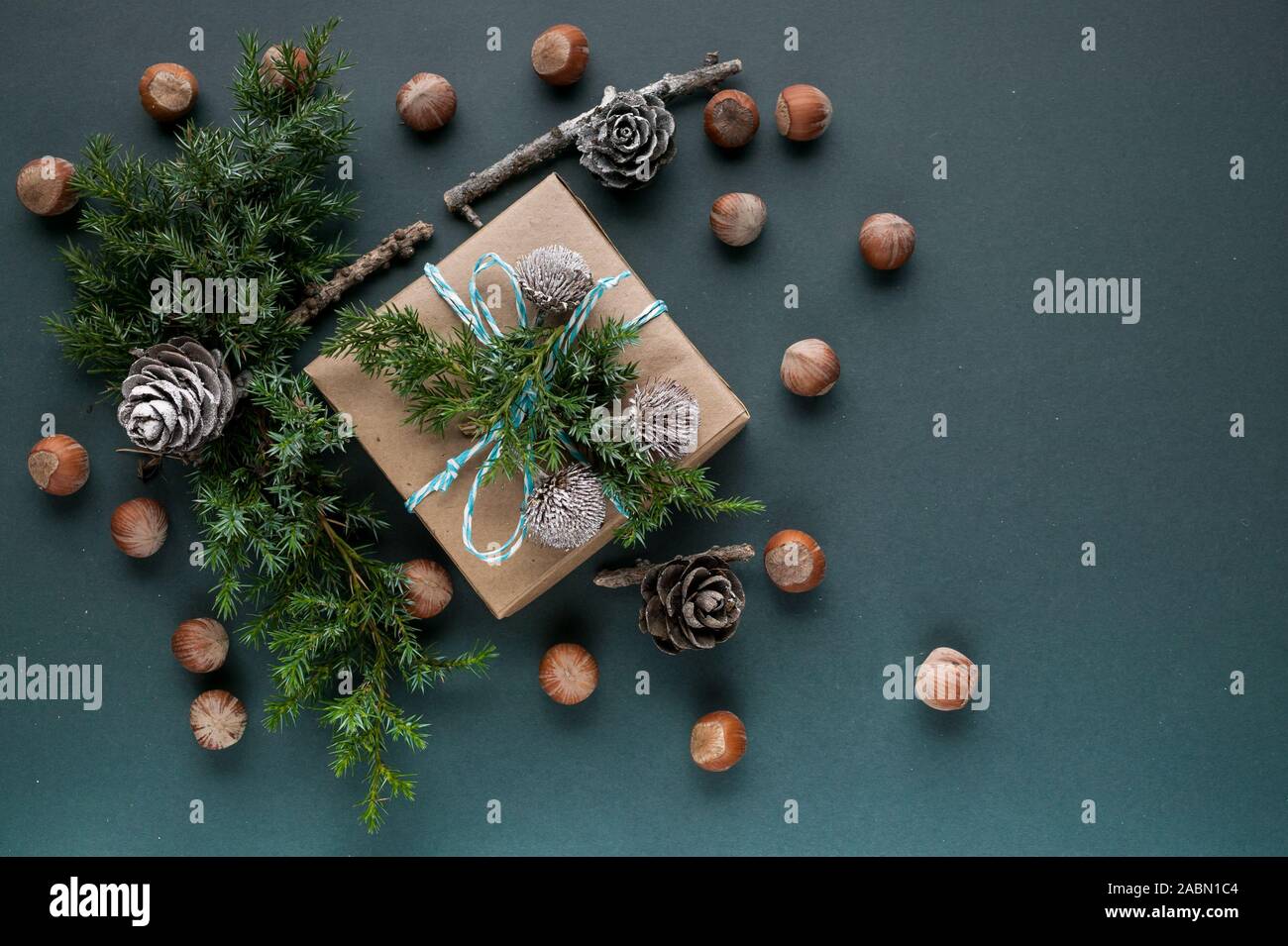 Christmas festive background gift box decoration on a dark green background. Top view Stock Photo