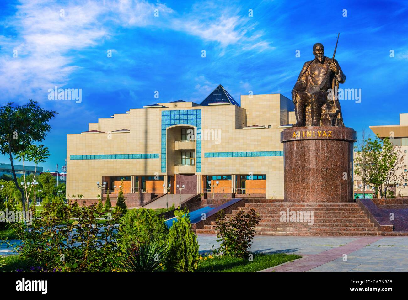 The monument of Karakalpak poet Ajiniyaz and the State Art Museum of the Republic of Karakalpakstan in Nukus, Uzbekistan Stock Photo