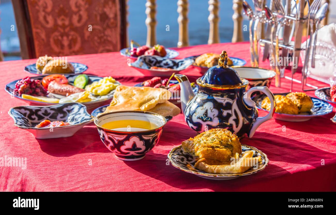 Traditional Uzbek breakfast served on the terrace Stock Photo - Alamy