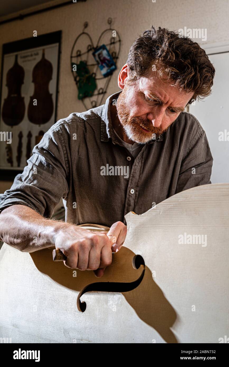 Troyes (north-eastern France): Laurent Demeyere, stringed instrument maker specialized in double bass. Here, making a double bass. Gestures and woodwo Stock Photo