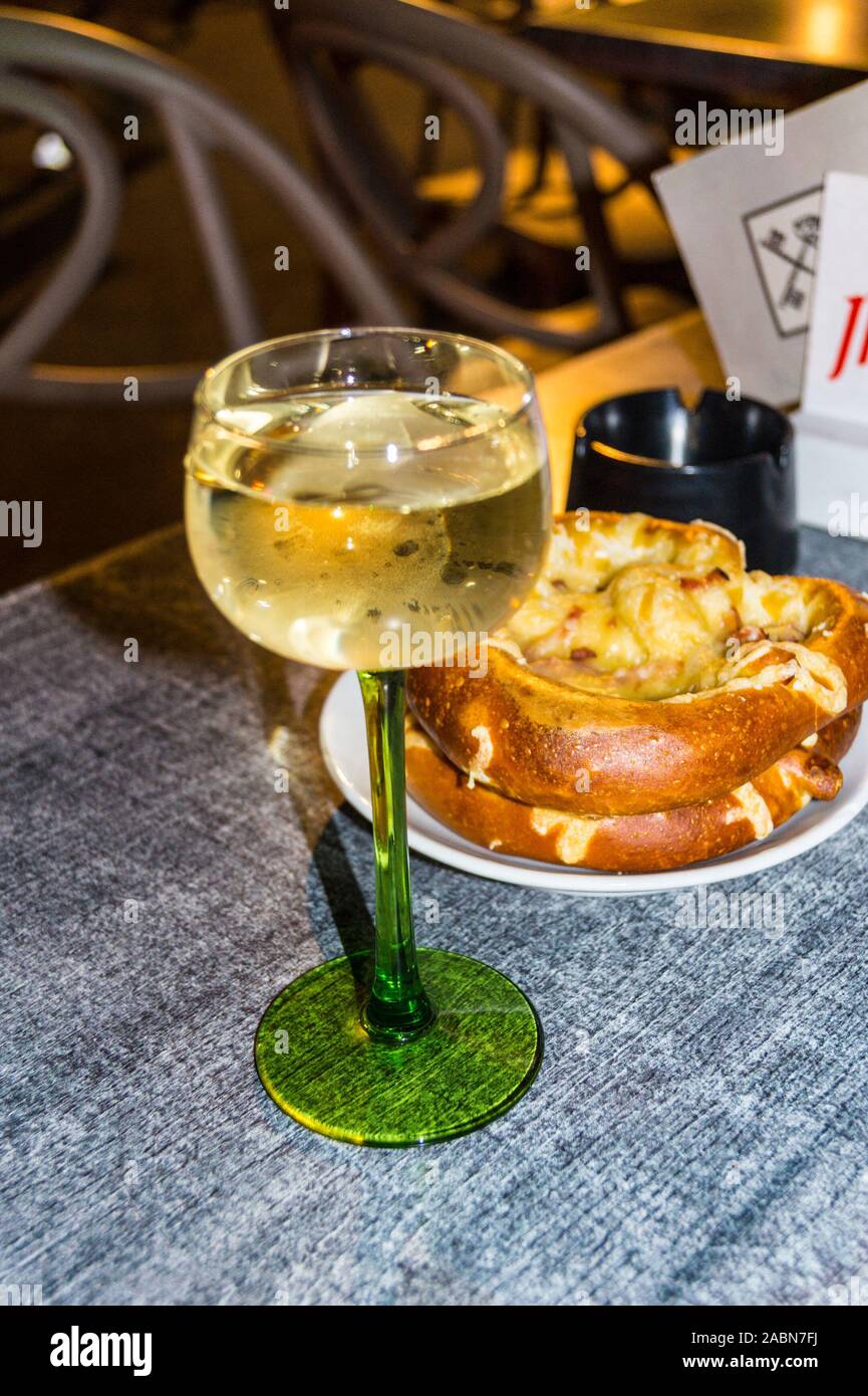 A glass of Alsace gewurztraminer white wine in its traditional glass