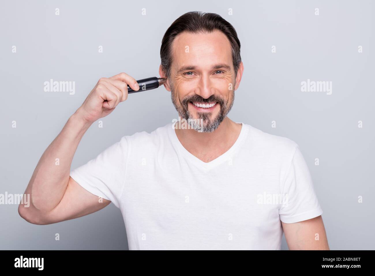 Photo Of Handsome Aged Man Guy Metrosexual Hold Electric Trimmer