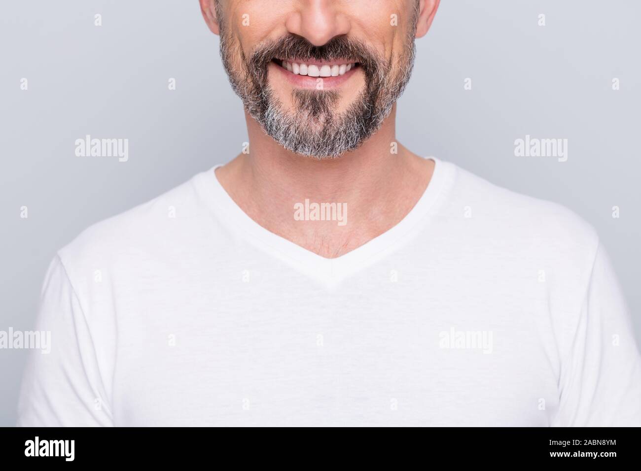 Closeup cropped photo of handsome aged man good mood beaming smile showing perfect groomed beard bleaching teeth wear white t-shirt isolated grey Stock Photo