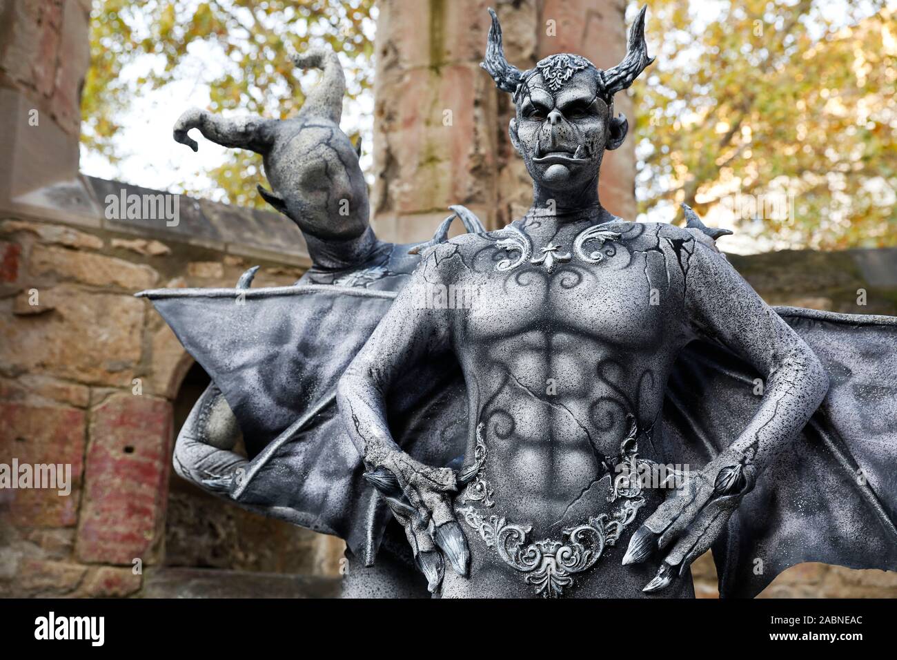 Hannover, Deutschland. 28th Nov, 2019. GEEK ART - Bodypainting and Transformaking: Gargoyle photoshooting with Enrico Lein and Marlena Wieland at the Nikolai graveyard in Hannover on November 28, 2019 - A project by the photographer Tschiponnique Skupin and the bodypainter Enrico Lein Credit: Geisler-Fotopress GmbH/Alamy Live News Stock Photo