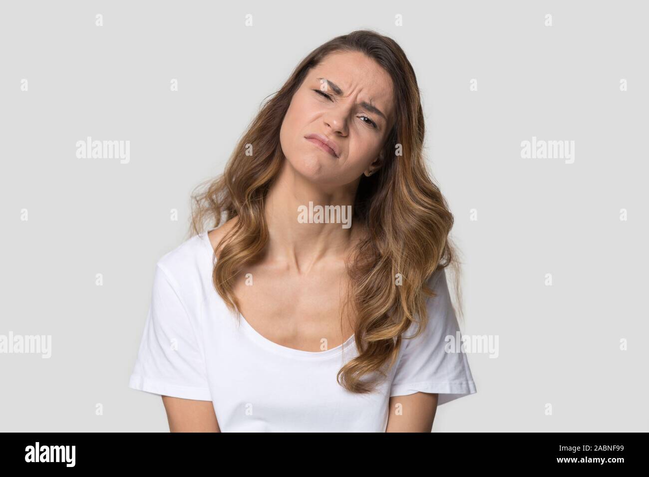 Unhappy tired young woman with pout lips feeling upset Stock Photo