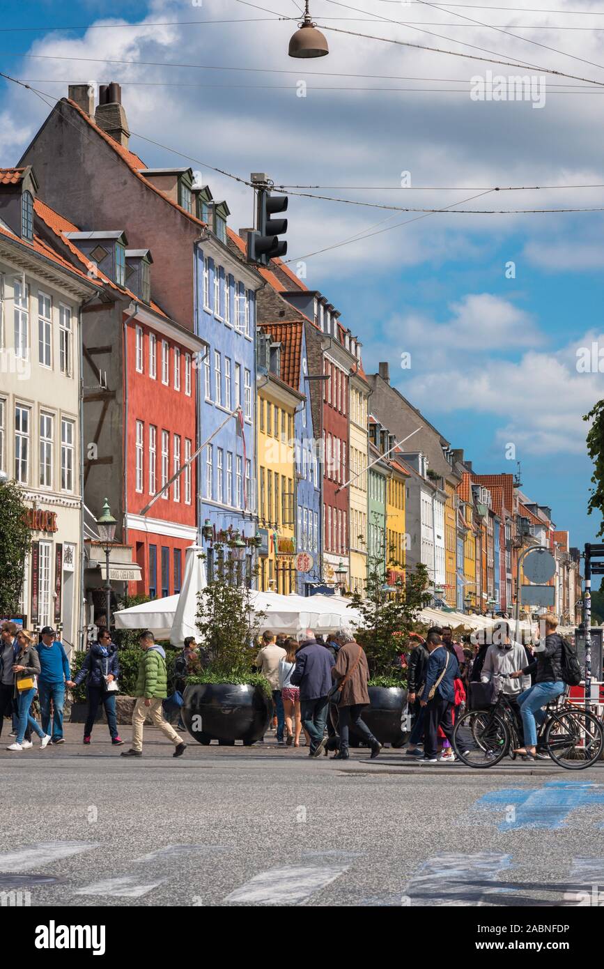 Copenhagen city, view of people walking in the colorful Nyhavn harbor area in Copenhagen, Denmark. Stock Photo