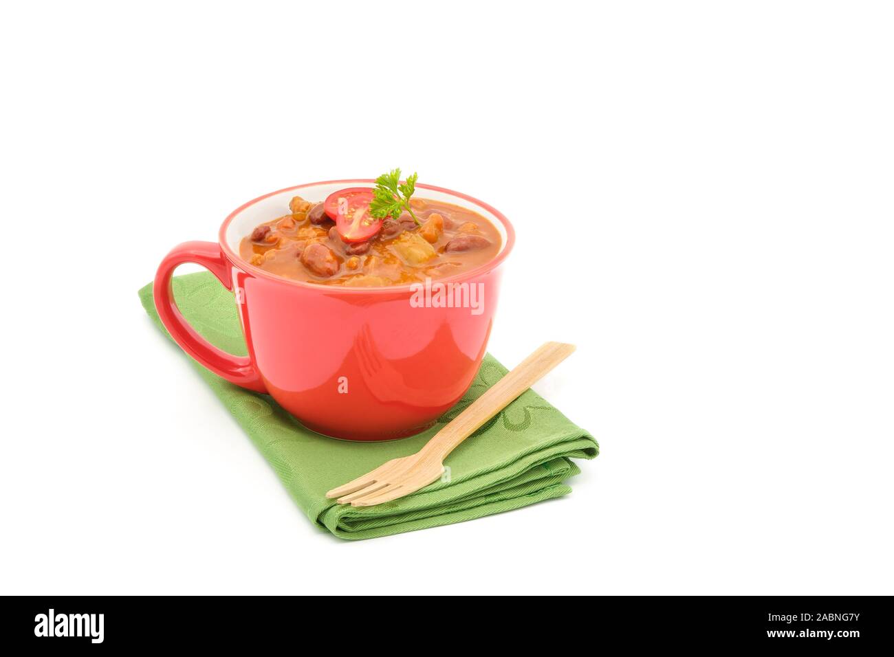 Cup of delicious homemade chile photographed on a white background with copy space. Stock Photo
