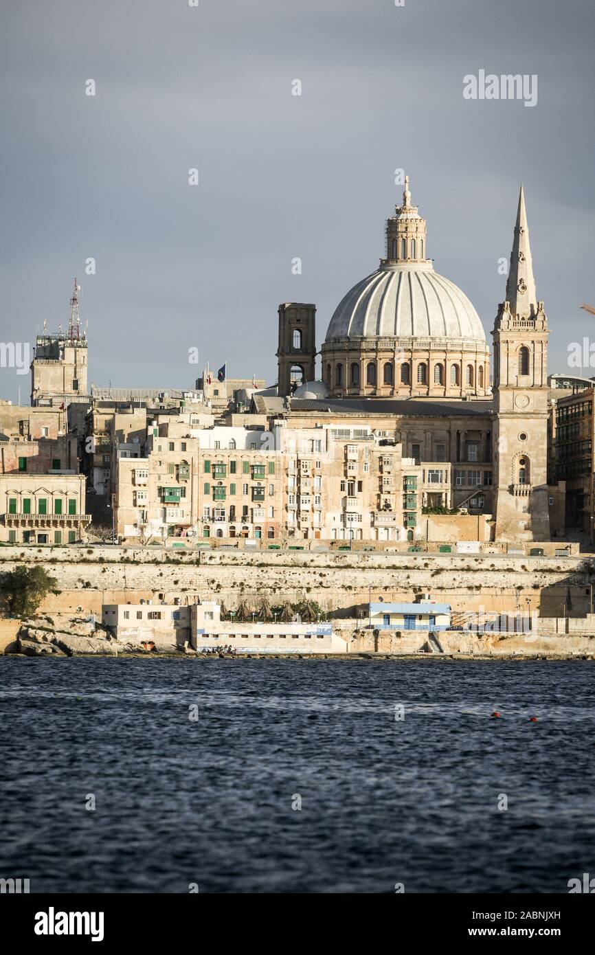Valletta, Malta. A view over Marsamxett harbor of the skyline of the Maltese capital dominated by the dome of St. Paul's Anglican Cathedral. Stock Photo