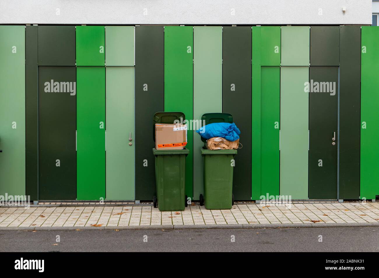 garbage cans with cardboard lettering in german very fragile Stock